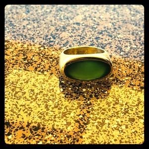 24K yellow gold band with oval shaped Jade stone